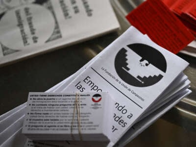 Cards from the United Farm Workers Foundation informing people of their constitutional rights are arranged for a photograph in Fresno, California, on February 12, 2025. With planting season well under way in California, the largest agriculture-producing state in the U.S., fear of deportation is taking root among thousands of migrant farm and poultry workers.